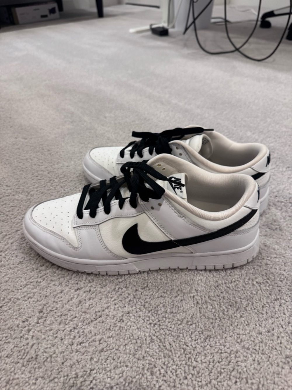 Nike White Low-Top Sneakers with Black Swoosh